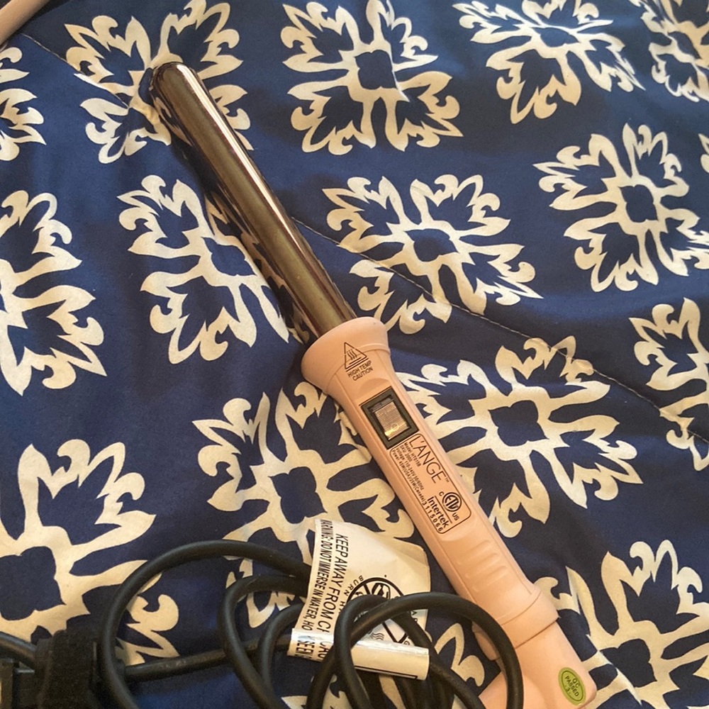 L’ange Le’Curl titanium curling wand.  Used a couple only a couple of times.